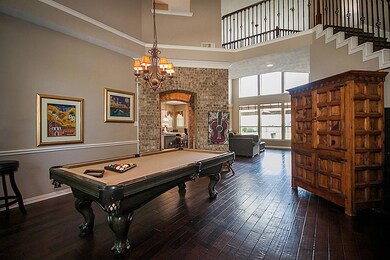 Entry way with wood floors. Crown molding. Beautiful view through the 6 windows.