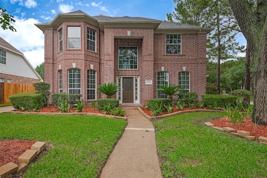 Welcome home! This stately two-story brick home bo