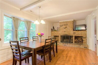 AN EXTENSION OF THE KITCHEN WITH A COZY BRICK FIRE