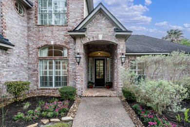 Notice the gas lanterns and shutters on the windows, as well as the gorgeous front door.