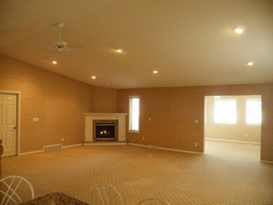 Living room with gas fireplace.