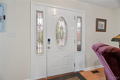 Foyer entrance with hardwood / wood-style flooring