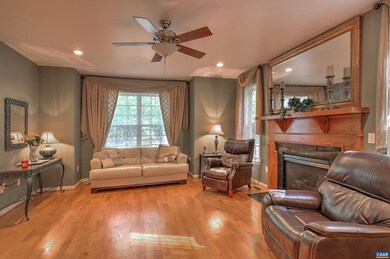 Fireplace features oak mantle and gas log (propane