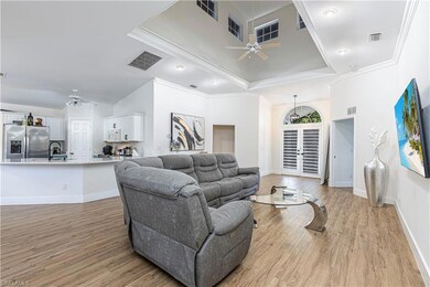Living room with light hardwood / wood-style floor