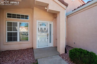 Property entrance with stucco siding