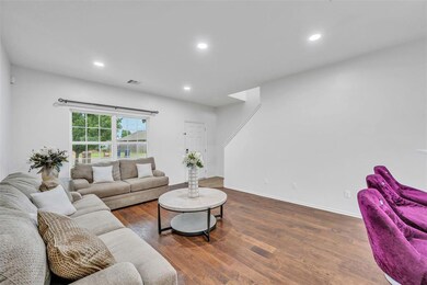 Living room featuring wood-style flooring