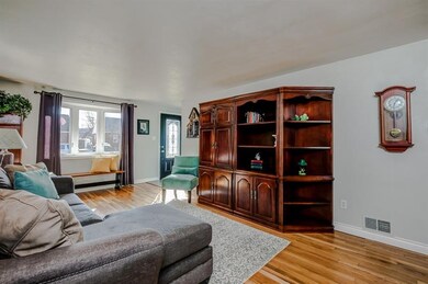 Beautiful hardwood floors flow throughout the livi
