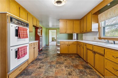 KITCHEN HAS A DINING AREA.