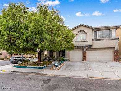 View of front of home featuring stucco siding, an attached garage, concrete driveway, and brick siding