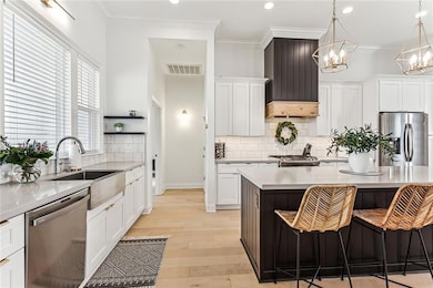 Stainless appliances (all will remain), ample coun