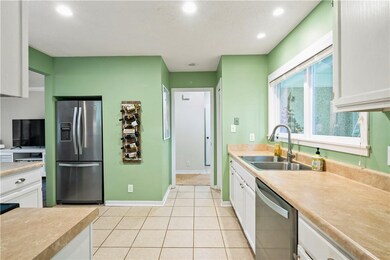Kitchen with recessed refrigerator