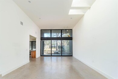 Empty room featuring baseboards, finished concret