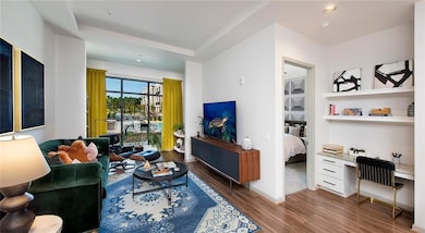 Living room with hardwood / wood-style floors