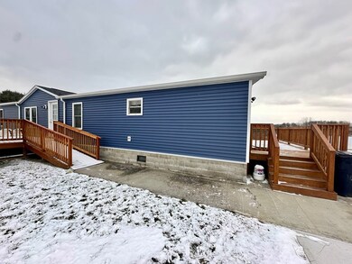 Front of house, with paved driveway