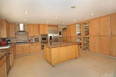 Large kitchen with central island, granite counter
