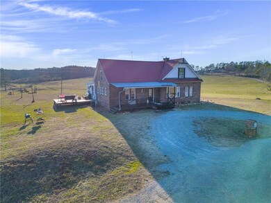 View of front facade with a front lawn and a porch