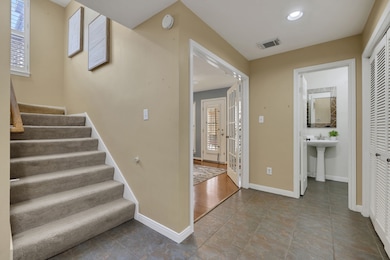 A sleek transitional space showcasing the stairway