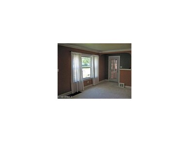 This door off the living room leads to the enclose
