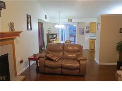 Vaulted ceiling and engineered hardwood flooring.