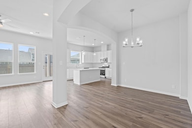 Unfurnished living room featuring dark wood-style
