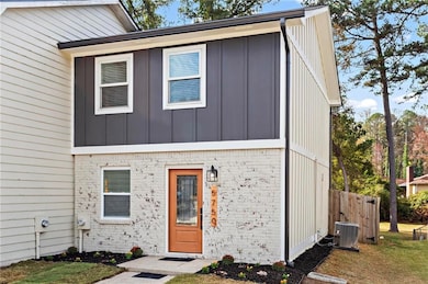 View of front of property with cooling unit