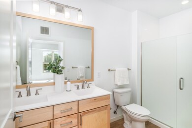 It is complete with a private ensuite 3/4 bath featuring a double vanity, quartz countertops, and a walk-in shower. A generous walk-in closet provides ample storage and organization.