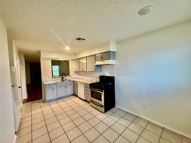 Kitchen featuring white appliances, under cabinet