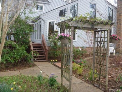 Welcoming arbor, flowering dogwoods, paths and dec