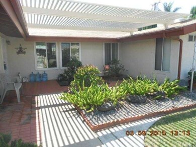 The light, bright lattice entryway features concre