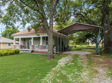 Fenced in area behind the home is visible in this photo.