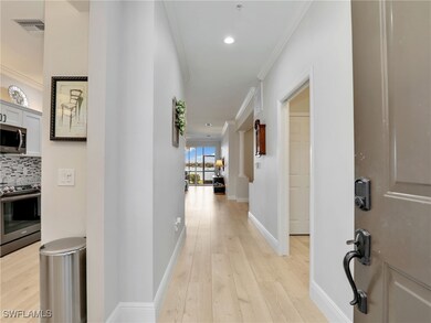 Corridor featuring baseboards, visible vents, rece
