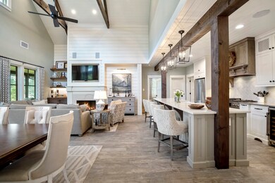 Wooden beams and shiplap provide a welcoming feeling in this custom designed luxurious cottage home. Gorgeous custom furnishings throughout are available.