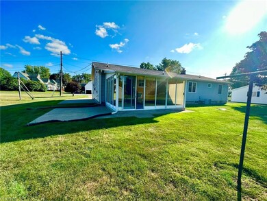 Rear view of house featuring a patio area and a la