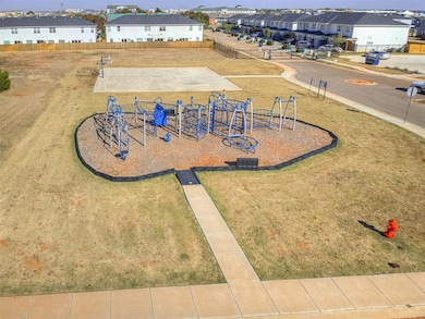 The neighborhood playground & basketball court are just across the street.