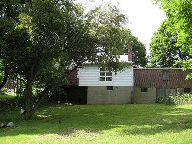 Exterior Back. Almost level rear yard.