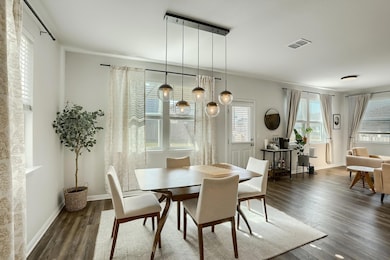 Dining space featuring wood finished floors and b