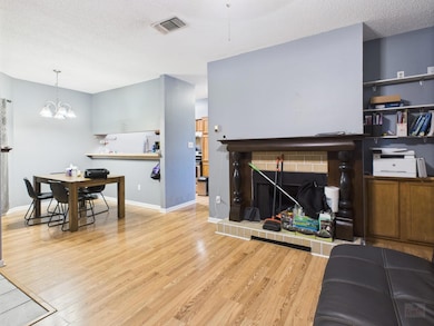 Living area featuring a chandelier, wood finished