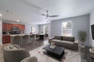 Living room with concrete floors, a ceiling fan, 
