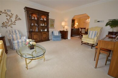 The bright living room is generously sized and com