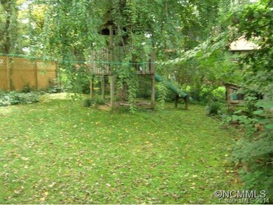 Back yard with tree house