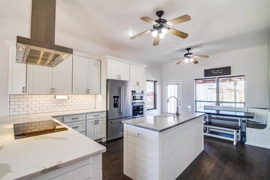 Absolutely stunning, remodeled kitchen with shiplap island, soft close cabinets and drawers, induction cooktop, farm sink and stainless appliances!