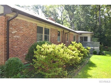 Side view of back of the house with deck.