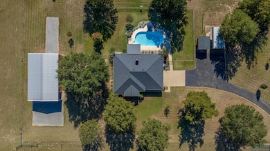 View from above of property featuring a pool