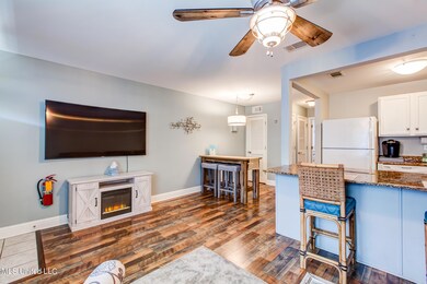 Unit 169-Entertainment area with 65 curv