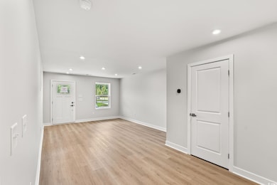 Foyer entrance featuring recessed lighting and light wood finished floors