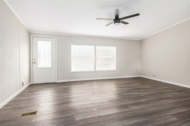 View of the living room from the breakfast area towards the front door