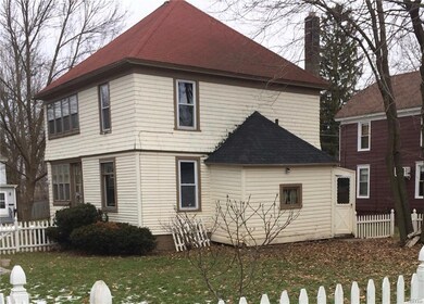 Side view showing attached mudroom/garden shed