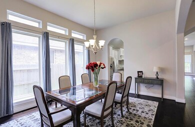 Amazing spacious formal dining room right off kitchen. Features a wall of windows and from this awesome view it is a pleasure to envision entertaining family and friends.