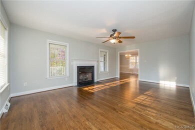 Entering the home on the left the Great Room with a fireplace and hearth.
