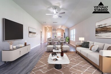 Open Concept living area - view back to kitchen an